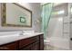 Bathroom with vanity, mirror, and tub-shower combination with modern fixtures at 8113 S 42Nd Dr, Laveen, AZ 85339