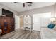 Bedroom showcasing unique furniture, laminate floors, and ample closet space at 8113 S 42Nd Dr, Laveen, AZ 85339