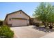 Lovely single-story home featuring a two-car garage, neutral color palette, and a brick-paved driveway at 8113 S 42Nd Dr, Laveen, AZ 85339