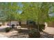 Well-manicured front yard featuring mature shade trees and complemented by neutral home exterior at 8113 S 42Nd Dr, Laveen, AZ 85339