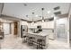 Bright kitchen with granite counters, stainless steel appliances, and a stylish island with seating at 8113 S 42Nd Dr, Laveen, AZ 85339