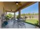Covered patio with outdoor dining area and relaxing backyard views at 8113 S 42Nd Dr, Laveen, AZ 85339