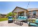 A patio features an outdoor seating area with a couch, chairs, and a coffee table at 8113 S 42Nd Dr, Laveen, AZ 85339