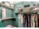 Walk-in closet featuring custom shelving and storage solutions for organized clothing and accessories at 8113 S 42Nd Dr, Laveen, AZ 85339