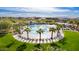 Scenic view of the community pool area, featuring lush landscaping, lounge chairs, and well-maintained grounds at 8318 W Palo Verde Dr, Glendale, AZ 85305