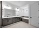 Bathroom with double sink vanity, soaking tub, and tile flooring at 8318 W Palo Verde Dr, Glendale, AZ 85305