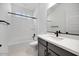 Bathroom featuring tub and shower combo with gray vanity and hardware at 8318 W Palo Verde Dr, Glendale, AZ 85305