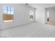 Bright bedroom features plush carpeting, white walls, and a view from its large windows at 8318 W Palo Verde Dr, Glendale, AZ 85305