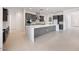 Open-concept kitchen with a large island, gray cabinetry, and stainless steel appliances, perfect for entertaining at 8318 W Palo Verde Dr, Glendale, AZ 85305