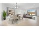 Open-concept living and dining area filled with natural light, featuring stylish furnishings for comfortable living at 8318 W Palo Verde Dr, Glendale, AZ 85305