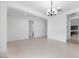 Open-concept living space showcases tile flooring, recessed lights, and views to the kitchen and backyard at 8318 W Palo Verde Dr, Glendale, AZ 85305