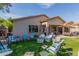 The backyard features a large artificial lawn and an outdoor seating area at 839 E Leo Pl, Chandler, AZ 85249