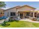 Inviting backyard with seating areas and a built-in grill at 839 E Leo Pl, Chandler, AZ 85249
