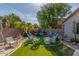 Charming backyard with artificial turf and an arrangement of seating for relaxing and entertaining at 839 E Leo Pl, Chandler, AZ 85249