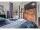 Cozy bedroom featuring a large window and a television above the dresser at 839 E Leo Pl, Chandler, AZ 85249