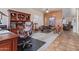Spacious home office features tile floors, a ceiling fan, and built-in wooden storage cabinets at 839 E Leo Pl, Chandler, AZ 85249