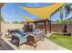 Outdoor patio features a grill, seating, and pergola with shade covering for outdoor comfort at 839 E Leo Pl, Chandler, AZ 85249
