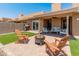 Outdoor space offers lounge chairs surrounding a fire pit for relaxing evenings at 9125 E Gelding Dr, Scottsdale, AZ 85260