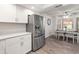 Bright kitchen featuring modern appliances, sleek countertops, and adjacent dining space at 9125 E Gelding Dr, Scottsdale, AZ 85260