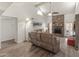 Inviting living room with vaulted ceiling, stone fireplace, and comfortable seating, perfect for relaxation at 9125 E Gelding Dr, Scottsdale, AZ 85260