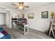 Home office with a ceiling fan and built-in shelving offers a comfortable workspace at 9125 E Gelding Dr, Scottsdale, AZ 85260
