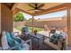 Charming covered patio with seating area offers an inviting outdoor living space at 9125 E Gelding Dr, Scottsdale, AZ 85260