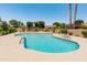 Inviting community pool with lounge chairs and clear blue water, perfect for relaxation and recreation at 9125 E Gelding Dr, Scottsdale, AZ 85260