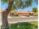 Picturesque street showcases well-maintained homes with manicured lawns and a serene neighborhood ambiance at 9125 E Gelding Dr, Scottsdale, AZ 85260