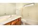 Bathroom with oak cabinets, single sink, and shower-tub combination at 9207 W Kirby Ave, Tolleson, AZ 85353