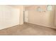 Carpeted bedroom features double-door closet for storage and natural light at 9207 W Kirby Ave, Tolleson, AZ 85353