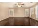 Bedroom with ceiling fan, hardwood floors, and three windows providing plenty of light at 9207 W Kirby Ave, Tolleson, AZ 85353