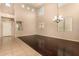 Spacious living room with wood floors, recessed lighting, lots of windows, and high ceilings at 9207 W Kirby Ave, Tolleson, AZ 85353