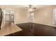 Living room with wood flooring, ceiling fan, and multiple entrances at 9207 W Kirby Ave, Tolleson, AZ 85353