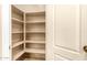Walk-in pantry with multiple shelves for ample storage at 9207 W Kirby Ave, Tolleson, AZ 85353