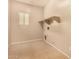 Utility room with shelving and hookups for a washer and dryer at 9207 W Kirby Ave, Tolleson, AZ 85353