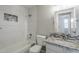 Modern bathroom with tiled shower, granite countertop and mosaic backsplash at 9330 E Plana Ave, Mesa, AZ 85212