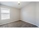Bedroom with neutral carpet, paint, and one window at 9330 E Plana Ave, Mesa, AZ 85212