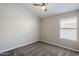 Bedroom with neutral carpet, paint, and one window at 9330 E Plana Ave, Mesa, AZ 85212