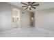 Large bedroom with ceiling fan and ensuite bathroom at 9330 E Plana Ave, Mesa, AZ 85212