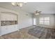 Dining area featuring built-in buffet and view to adjacent living area with access to back patio at 9330 E Plana Ave, Mesa, AZ 85212