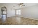 Bright living space with neutral paint, ceiling fan, and tile floors at 9330 E Plana Ave, Mesa, AZ 85212