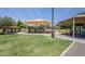 Community playground and recreation area with slides, climbing structures, and covered seating for residents at 9330 E Plana Ave, Mesa, AZ 85212