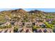 Community aerial showcasing well-maintained homes with desert landscaping and mountain views at 9532 E Knoll Cir, Mesa, AZ 85207