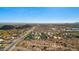 Breathtaking aerial shot of a community blending seamlessly with the desert landscape and blue sky at 9532 E Knoll Cir, Mesa, AZ 85207