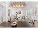 Elegant dining room with vaulted ceilings, large windows, and open floorplan at 9532 E Knoll Cir, Mesa, AZ 85207