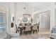 Open-concept dining area flowing into the living room, bathed in natural light at 9532 E Knoll Cir, Mesa, AZ 85207