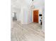 Inviting foyer featuring decorative tile inlay, wood front door, and natural light at 9532 E Knoll Cir, Mesa, AZ 85207