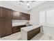 Bright home office with custom built-in cabinets, stylish desk and large window with plantation shutters at 9532 E Knoll Cir, Mesa, AZ 85207