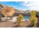 Beautiful backyard oasis with a sparkling pool and lush landscaping at 9532 E Knoll Cir, Mesa, AZ 85207