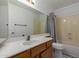 Small bathroom featuring a vanity, mirror, shower, bath tub and toilet at 987 E Divot Dr, Tempe, AZ 85283